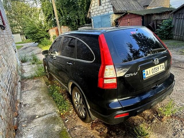 Черный Хонда СРВ, объемом двигателя 2.4 л и пробегом 210 тыс. км за 10000 $, фото 1 на Automoto.ua