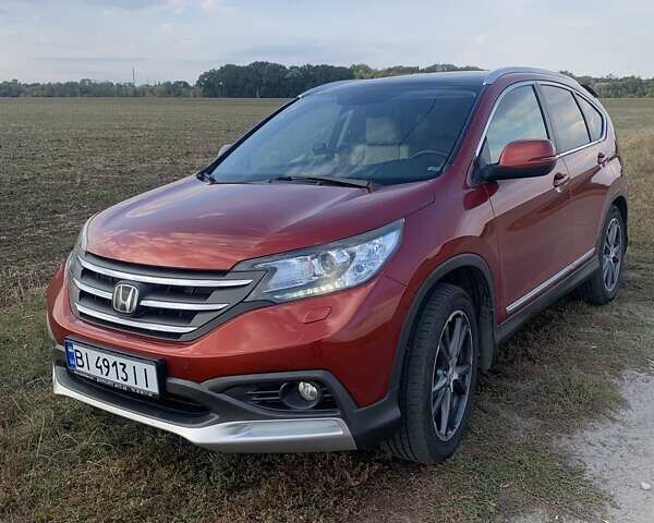 Красный Хонда СРВ, объемом двигателя 2.2 л и пробегом 210 тыс. км за 16800 $, фото 1 на Automoto.ua