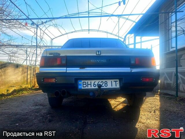 Серый Хонда Цивик, объемом двигателя 1.4 л и пробегом 280 тыс. км за 750 $, фото 1 на Automoto.ua