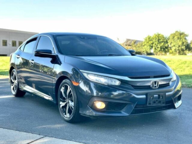 Серый Хонда Цивик, объемом двигателя 1.5 л и пробегом 57 тыс. км за 12650 $, фото 1 на Automoto.ua