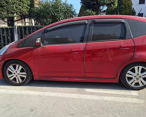 Красный Хонда Джаз, объемом двигателя 1.34 л и пробегом 122 тыс. км за 6900 $, фото 1 на Automoto.ua