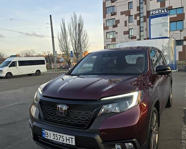 Красный Хонда Пасспорт, объемом двигателя 3.47 л и пробегом 87 тыс. км за 21999 $, фото 1 на Automoto.ua
