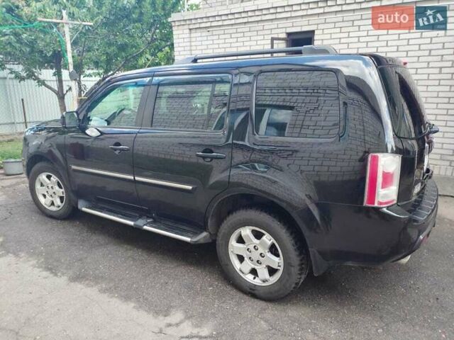 Чорний Хонда Пілот, об'ємом двигуна 3.5 л та пробігом 244 тис. км за 11500 $, фото 1 на Automoto.ua