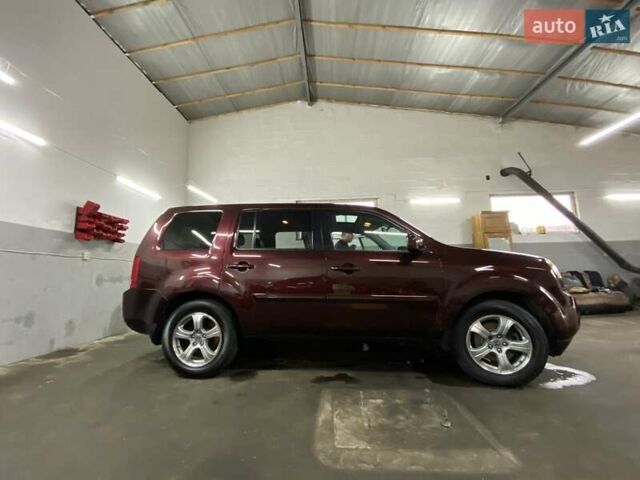 Красный Хонда Пилот, объемом двигателя 3.47 л и пробегом 125 тыс. км за 15500 $, фото 1 на Automoto.ua