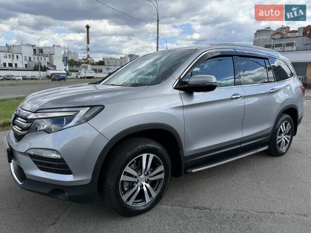 Серый Хонда Пилот, объемом двигателя 3 л и пробегом 125 тыс. км за 23500 $, фото 1 на Automoto.ua