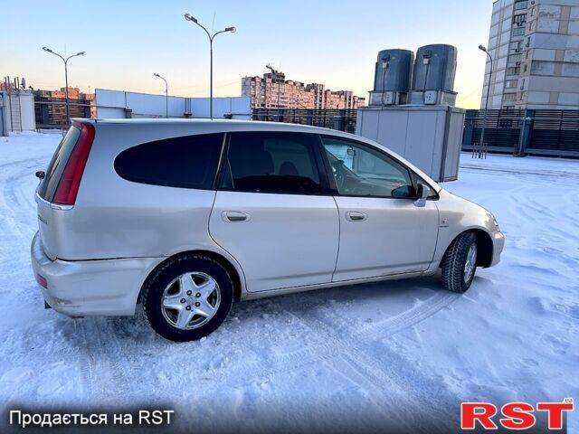 Желтый Хонда Стрим, объемом двигателя 2 л и пробегом 321 тыс. км за 3600 $, фото 1 на Automoto.ua