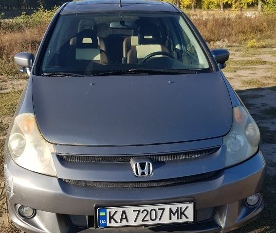 Серый Хонда Стрим, объемом двигателя 2 л и пробегом 289 тыс. км за 4500 $, фото 1 на Automoto.ua