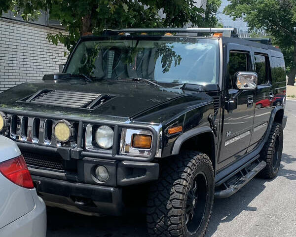 Черный Хаммер Н2, объемом двигателя 5.97 л и пробегом 189 тыс. км за 25000 $, фото 1 на Automoto.ua