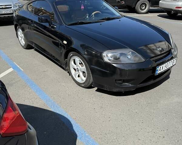 Чорний Хендай Купе, об'ємом двигуна 2 л та пробігом 112 тис. км за 5999 $, фото 1 на Automoto.ua