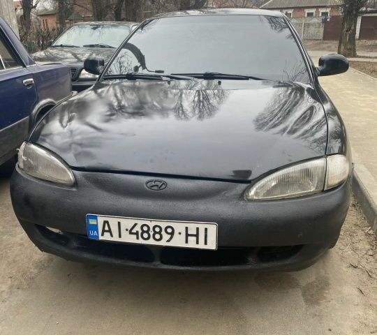 Черный Хендай Элантра, объемом двигателя 1.8 л и пробегом 400 тыс. км за 1500 $, фото 1 на Automoto.ua