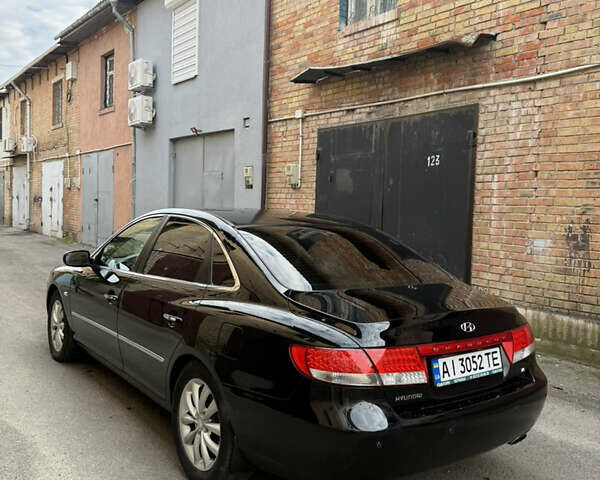 Черный Хендай Грандер, объемом двигателя 3.34 л и пробегом 299 тыс. км за 4999 $, фото 1 на Automoto.ua