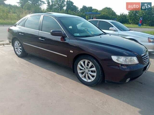 Красный Хендай Грандер, объемом двигателя 3.34 л и пробегом 243 тыс. км за 3500 $, фото 1 на Automoto.ua