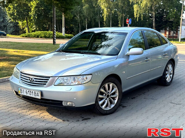 Серый Хендай Грандер, объемом двигателя 3.3 л и пробегом 261 тыс. км за 4999 $, фото 1 на Automoto.ua