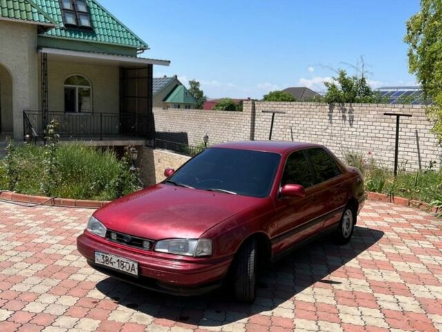 Красный Хендай Лантра, объемом двигателя 1.6 л и пробегом 260 тыс. км за 1000 $, фото 1 на Automoto.ua