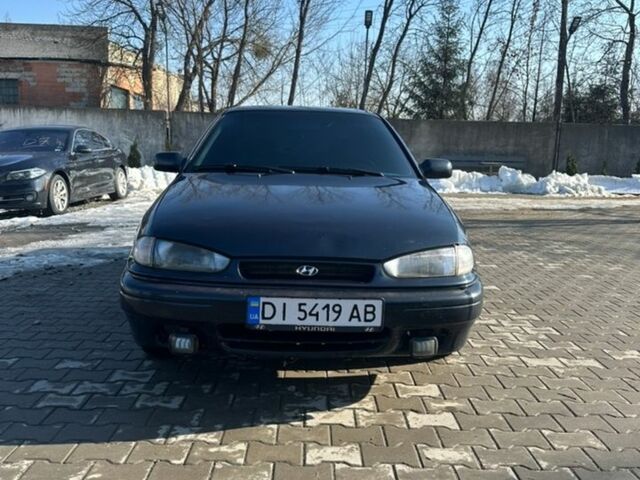 Синий Хендай Лантра, объемом двигателя 1.6 л и пробегом 301 тыс. км за 1650 $, фото 1 на Automoto.ua
