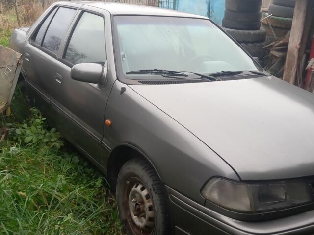 Серый Хендай Пони, объемом двигателя 1.5 л и пробегом 375 тыс. км за 382 $, фото 1 на Automoto.ua