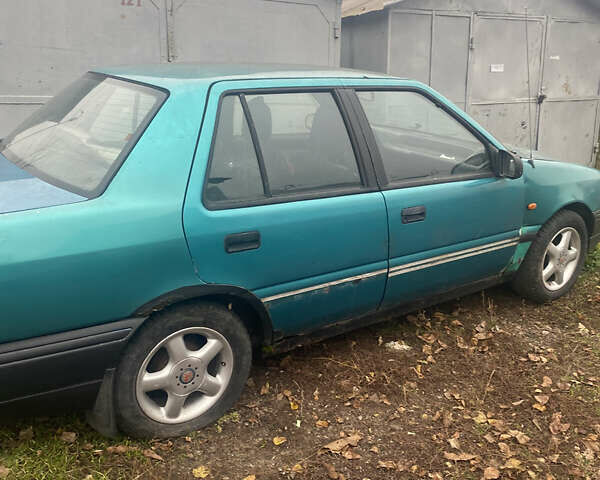 Зеленый Хендай Пони, объемом двигателя 1.5 л и пробегом 230 тыс. км за 1100 $, фото 1 на Automoto.ua