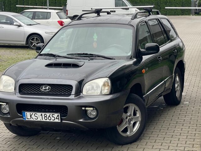 Черный Хендай Санта Фе, объемом двигателя 2 л и пробегом 300 тыс. км за 2925 $, фото 1 на Automoto.ua