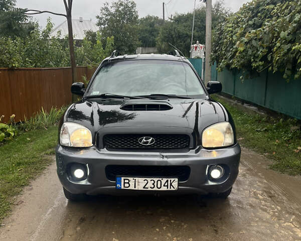 Черный Хендай Санта Фе, объемом двигателя 2 л и пробегом 271 тыс. км за 4000 $, фото 1 на Automoto.ua