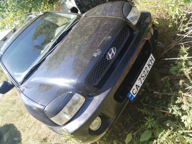 Черный Хендай Санта Фе, объемом двигателя 2.4 л и пробегом 295 тыс. км за 3100 $, фото 1 на Automoto.ua