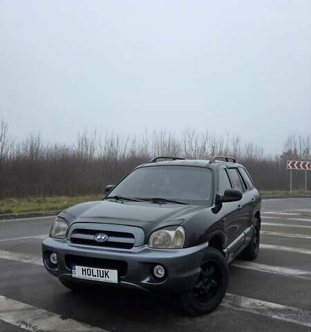 Черный Хендай Санта Фе, объемом двигателя 2 л и пробегом 227 тыс. км за 6700 $, фото 1 на Automoto.ua