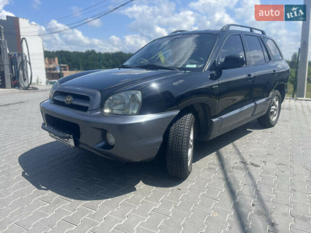 Чорний Хендай Санта Фе, об'ємом двигуна 2.4 л та пробігом 300 тис. км за 5800 $, фото 1 на Automoto.ua
