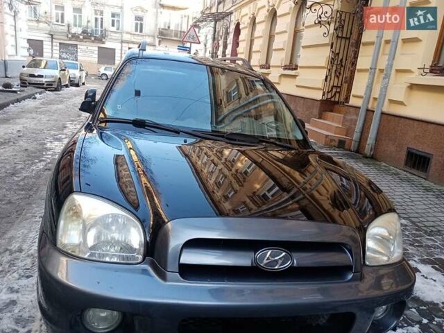 Черный Хендай Санта Фе, объемом двигателя 2 л и пробегом 194 тыс. км за 7500 $, фото 1 на Automoto.ua