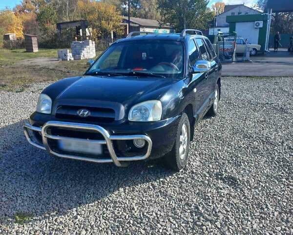 Черный Хендай Санта Фе, объемом двигателя 2.35 л и пробегом 313 тыс. км за 5500 $, фото 1 на Automoto.ua