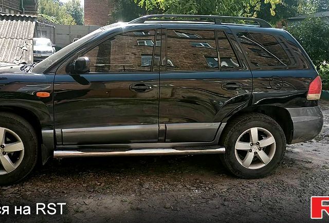 Черный Хендай Санта Фе, объемом двигателя 2 л и пробегом 200 тыс. км за 5100 $, фото 1 на Automoto.ua