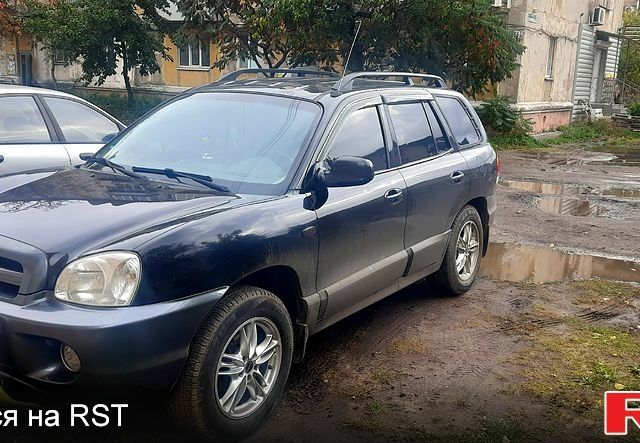 Черный Хендай Санта Фе, объемом двигателя 2.4 л и пробегом 330 тыс. км за 6300 $, фото 1 на Automoto.ua