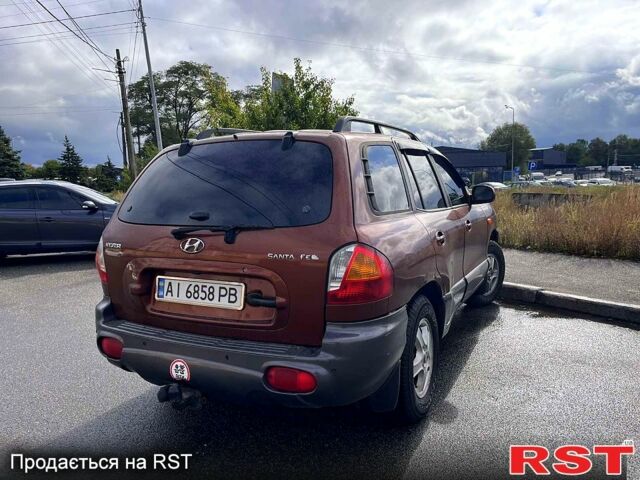 Коричневый Хендай Санта Фе, объемом двигателя 2.4 л и пробегом 250 тыс. км за 4999 $, фото 1 на Automoto.ua