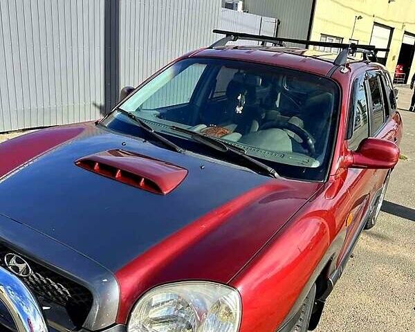 Красный Хендай Санта Фе, объемом двигателя 2 л и пробегом 100 тыс. км за 6300 $, фото 1 на Automoto.ua