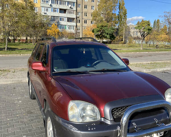 Красный Хендай Санта Фе, объемом двигателя 2.4 л и пробегом 256 тыс. км за 4000 $, фото 1 на Automoto.ua