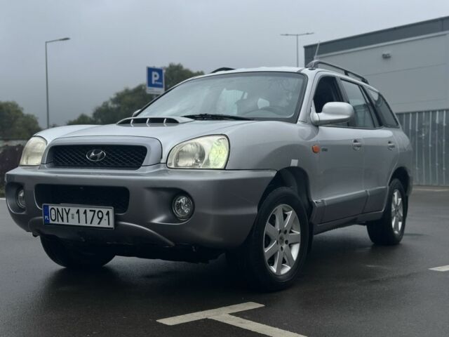 Серый Хендай Санта Фе, объемом двигателя 2 л и пробегом 241 тыс. км за 3159 $, фото 1 на Automoto.ua