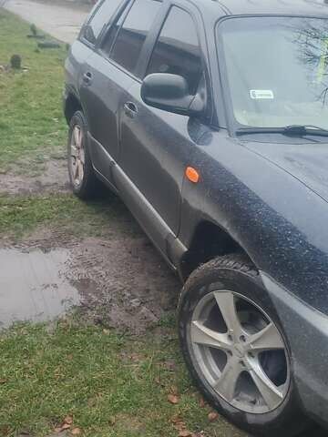 Синий Хендай Санта Фе, объемом двигателя 2 л и пробегом 254 тыс. км за 3150 $, фото 1 на Automoto.ua