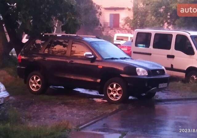 Синий Хендай Санта Фе, объемом двигателя 2.02 л и пробегом 330 тыс. км за 5000 $, фото 1 на Automoto.ua