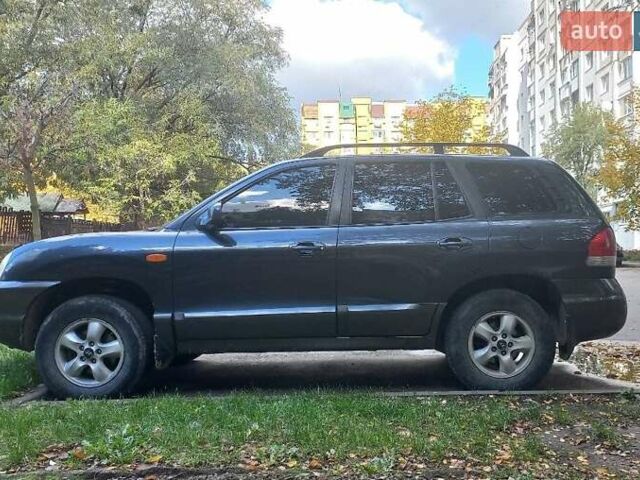 Синий Хендай Санта Фе, объемом двигателя 2.7 л и пробегом 336 тыс. км за 6000 $, фото 1 на Automoto.ua