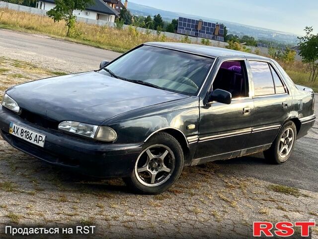 Черный Хендай Соната, объемом двигателя 2 л и пробегом 200 тыс. км за 950 $, фото 1 на Automoto.ua