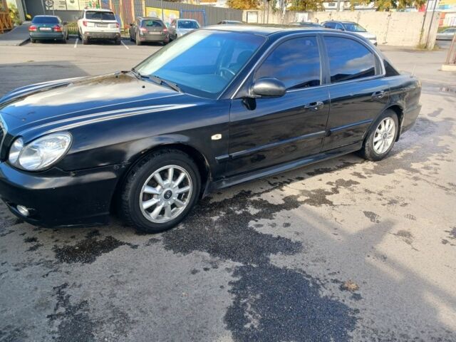 Черный Хендай Соната, объемом двигателя 2 л и пробегом 346 тыс. км за 3000 $, фото 1 на Automoto.ua