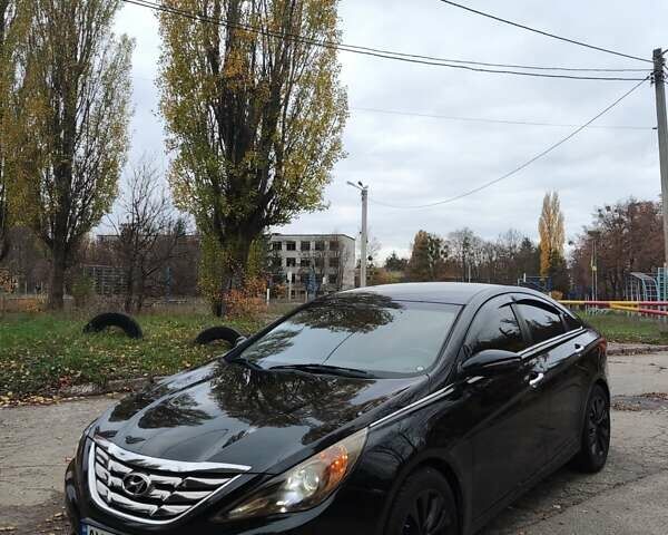 Черный Хендай Соната, объемом двигателя 2 л и пробегом 216 тыс. км за 7499 $, фото 1 на Automoto.ua