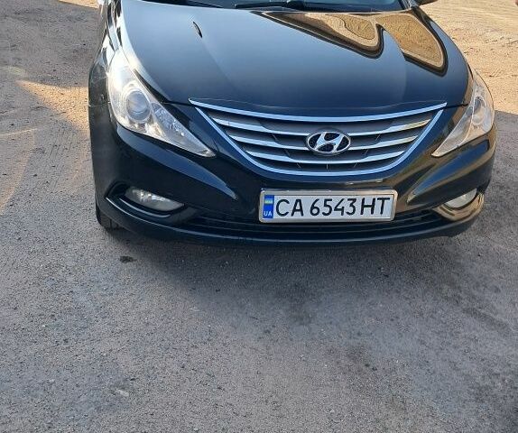 Черный Хендай Соната, объемом двигателя 2 л и пробегом 170 тыс. км за 7730 $, фото 1 на Automoto.ua
