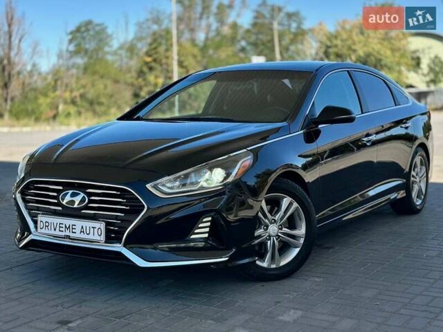Черный Хендай Соната, объемом двигателя 2.4 л и пробегом 174 тыс. км за 11799 $, фото 1 на Automoto.ua