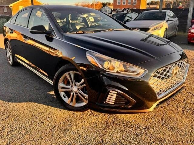 Черный Хендай Соната, объемом двигателя 2.4 л и пробегом 47 тыс. км за 6050 $, фото 1 на Automoto.ua