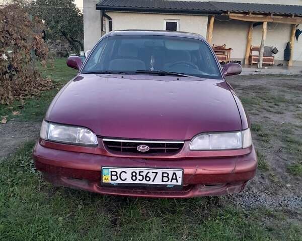 Червоний Хендай Соната, об'ємом двигуна 2 л та пробігом 206 тис. км за 1000 $, фото 1 на Automoto.ua