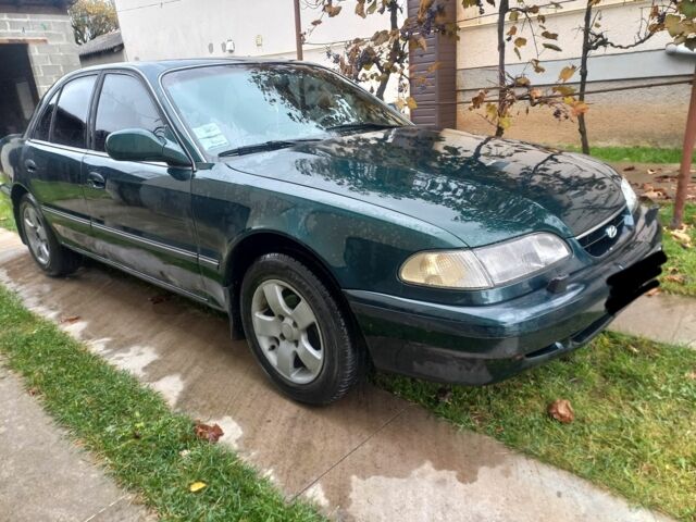 Зеленый Хендай Соната, объемом двигателя 2 л и пробегом 308 тыс. км за 1800 $, фото 1 на Automoto.ua