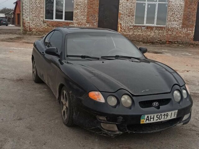 Черный Хендай Тибурон, объемом двигателя 2 л и пробегом 175 тыс. км за 3000 $, фото 1 на Automoto.ua