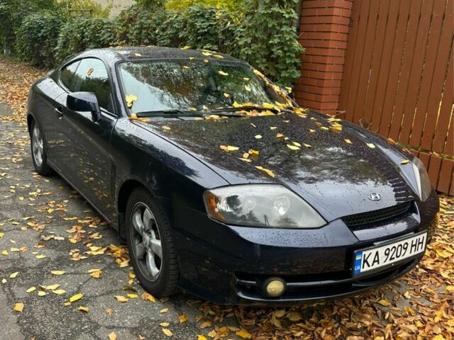 Синий Хендай Тибурон, объемом двигателя 2 л и пробегом 165 тыс. км за 6395 $, фото 1 на Automoto.ua