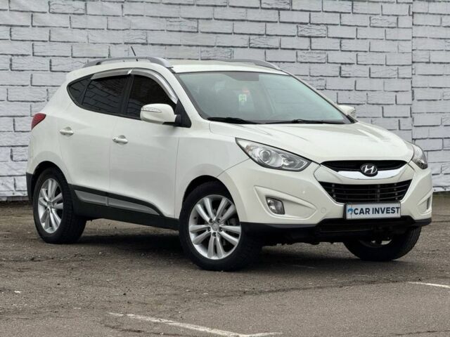 Белый Хендай Туксон, объемом двигателя 2 л и пробегом 232 тыс. км за 12200 $, фото 1 на Automoto.ua