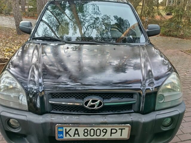 Черный Хендай Туксон, объемом двигателя 2 л и пробегом 320 тыс. км за 7000 $, фото 1 на Automoto.ua