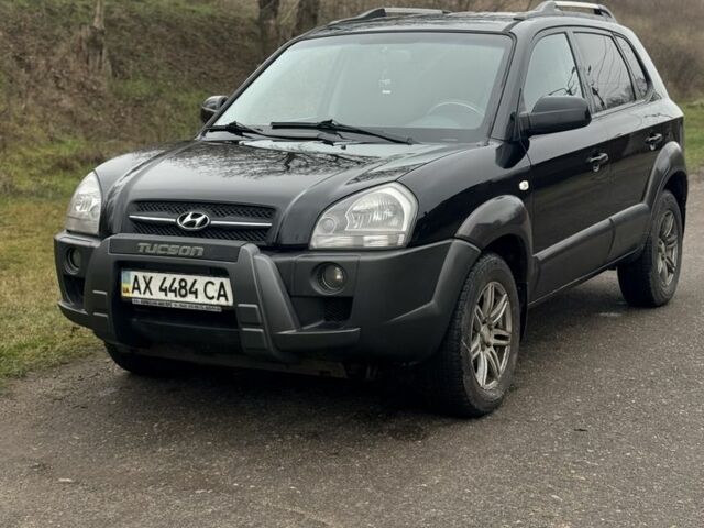 Черный Хендай Туксон, объемом двигателя 2 л и пробегом 220 тыс. км за 7000 $, фото 1 на Automoto.ua